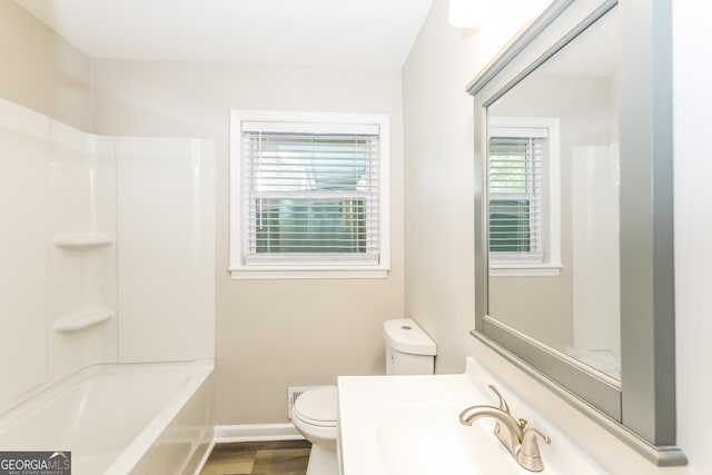 338 Mount Zion Rd, Hapeville, GA 30354 - bathroom featuring toilet, baseboards, vanity, and wood finished floors