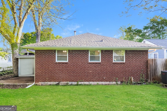 338 Mount Zion Rd, Hapeville, GA 30354 - view of side of property with brick siding, a yard, and fence