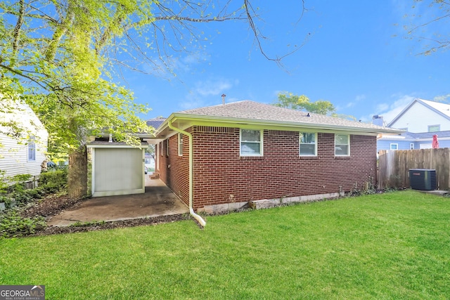 338 Mount Zion Rd, Hapeville, GA 30354 - rear view of property with a patio area, fence, brick siding, a yard, and central AC unit