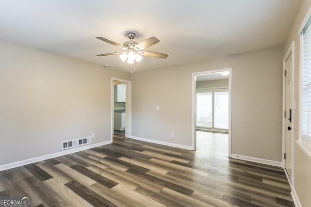 338 Mount Zion Rd, Hapeville, GA 30354 - empty room with baseboards, a ceiling fan, visible vents, and dark wood finished floors