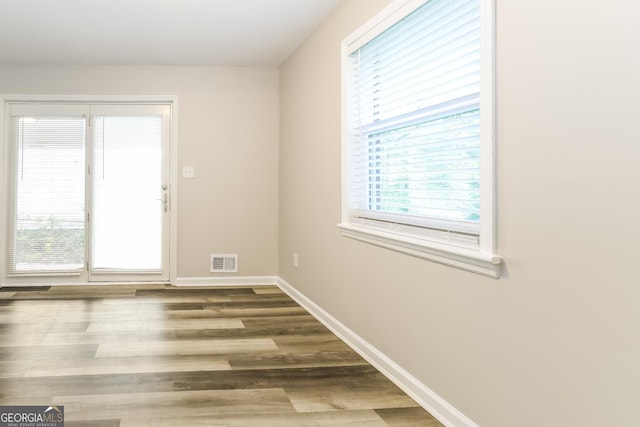 338 Mount Zion Rd, Hapeville, GA 30354 - spare room featuring plenty of natural light, visible vents, wood finished floors, and baseboards