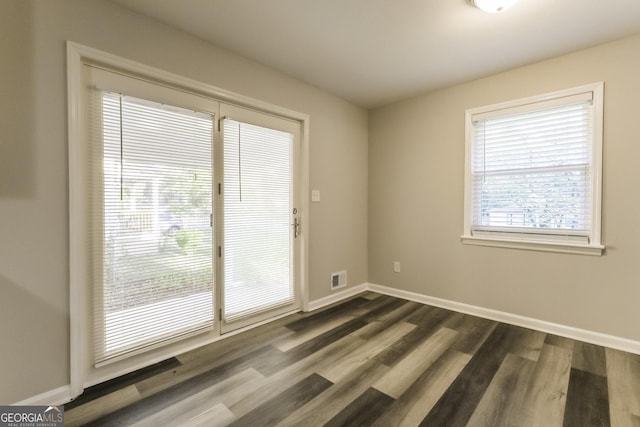 338 Mount Zion Rd, Hapeville, GA 30354 - unfurnished room featuring visible vents, baseboards, and dark wood-type flooring