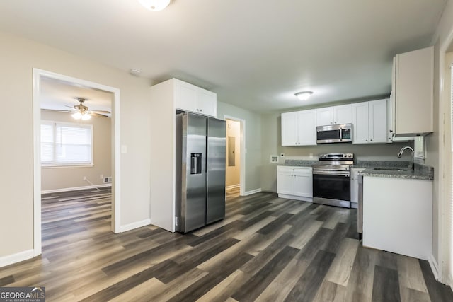 338 Mount Zion Rd, Hapeville, GA 30354 - kitchen featuring a sink, stainless steel appliances, dark wood finished floors, white cabinetry, and baseboards