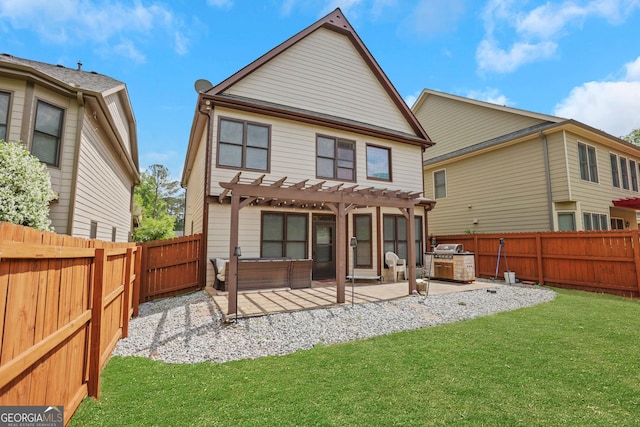 back of house with a yard, a patio, a pergola, and a fenced backyard