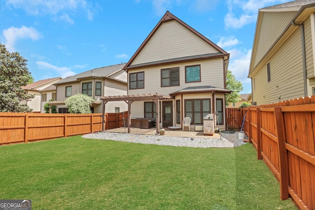 rear view of property featuring a patio, a pergola, a lawn, and a fenced backyard