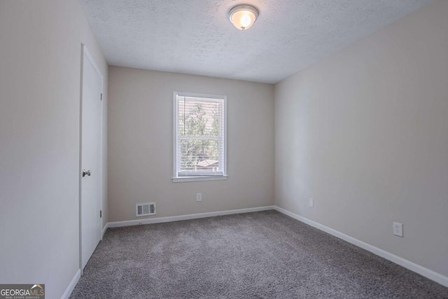 3938 Emerald Springs Ct, Decatur, GA 30035 - carpeted spare room featuring baseboards, visible vents, and a textured ceiling