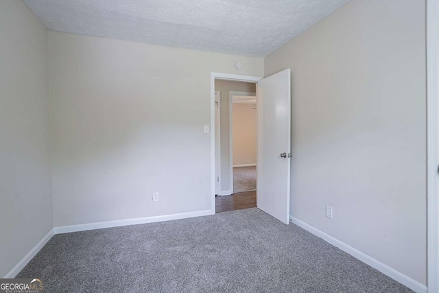 3938 Emerald Springs Ct, Decatur, GA 30035 - carpeted empty room with baseboards and a textured ceiling