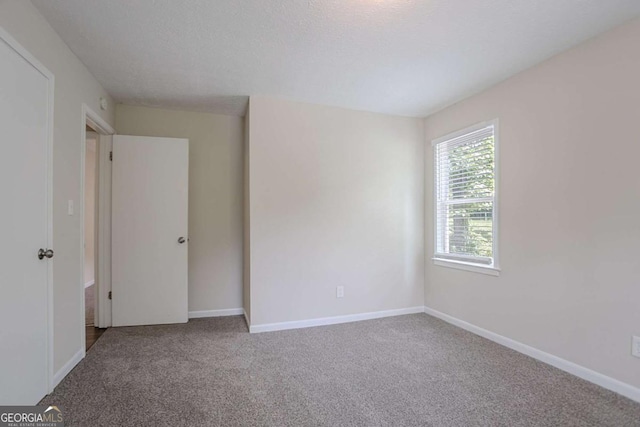 3938 Emerald Springs Ct, Decatur, GA 30035 - carpeted empty room with baseboards