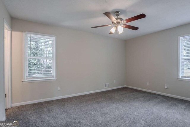 3938 Emerald Springs Ct, Decatur, GA 30035 - empty room with ceiling fan, carpet flooring, baseboards, and visible vents
