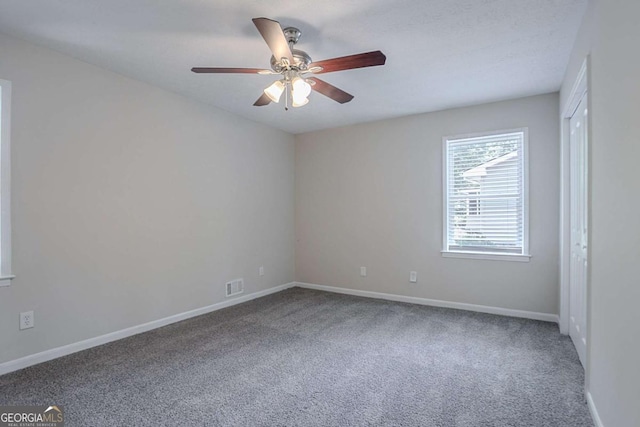 3938 Emerald Springs Ct, Decatur, GA 30035 - spare room with visible vents, baseboards, ceiling fan, and carpet floors