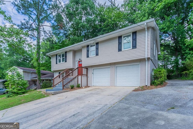 3938 Emerald Springs Ct, Decatur, GA 30035 - raised ranch featuring brick siding, driveway, and a garage