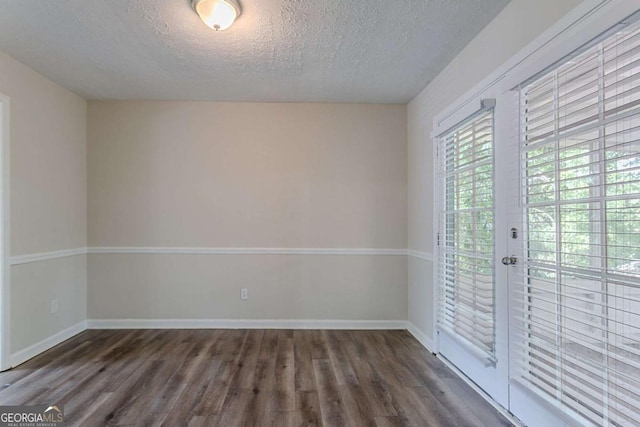 3938 Emerald Springs Ct, Decatur, GA 30035 - unfurnished room with baseboards, a textured ceiling, and wood finished floors