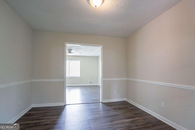 3938 Emerald Springs Ct, Decatur, GA 30035 - unfurnished room featuring a textured ceiling, wood finished floors, and baseboards