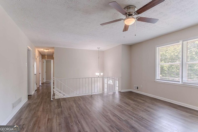 3938 Emerald Springs Ct, Decatur, GA 30035 - unfurnished room featuring a textured ceiling, baseboards, visible vents, and wood finished floors