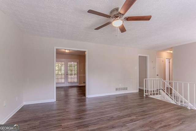 3938 Emerald Springs Ct, Decatur, GA 30035 - empty room featuring dark wood-style flooring, a textured ceiling, ceiling fan, and visible vents