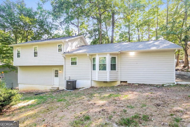 back of house featuring central AC