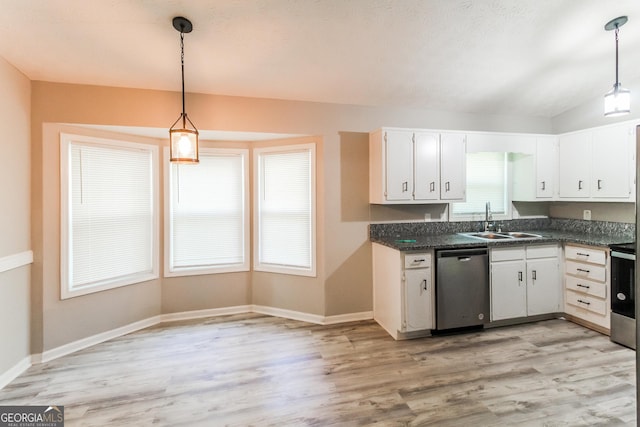 kitchen featuring a sink, white cabinetry, stainless steel dishwasher, dark countertops, and light wood-style floors