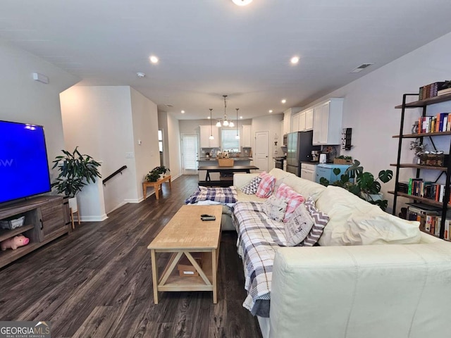 living room with baseboards, dark wood-style floors, visible vents, and recessed lighting