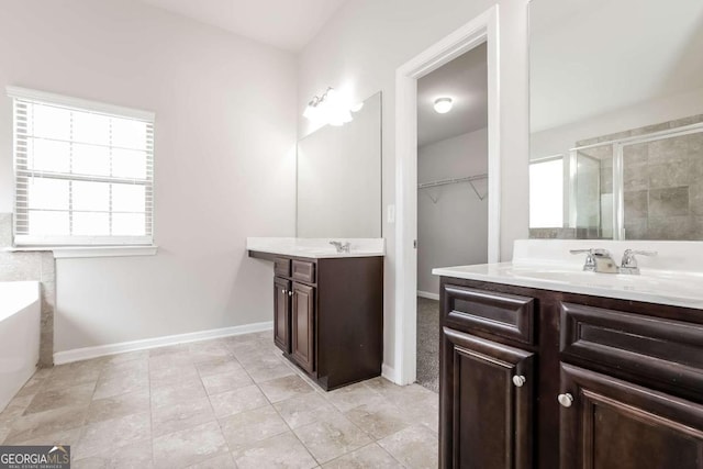 7843 Shertall St, Fairburn, GA 30213 - full bathroom featuring a sink, two vanities, tile patterned flooring, baseboards, and a shower stall