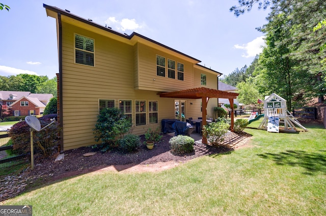 621 Oakbourne Way, Woodstock, GA 30188 - back of house with a playground, a yard, and a patio area