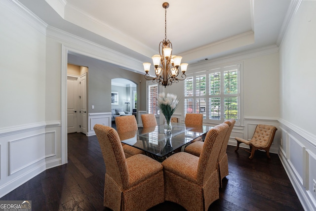 621 Oakbourne Way, Woodstock, GA 30188 - dining room with arched walkways, a chandelier, dark wood-style flooring, a decorative wall, and a wainscoted wall