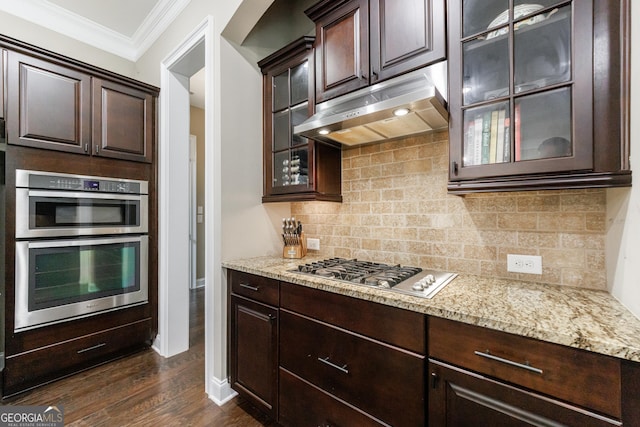 621 Oakbourne Way, Woodstock, GA 30188 - kitchen featuring under cabinet range hood, stainless steel appliances, ornamental molding, and dark brown cabinets