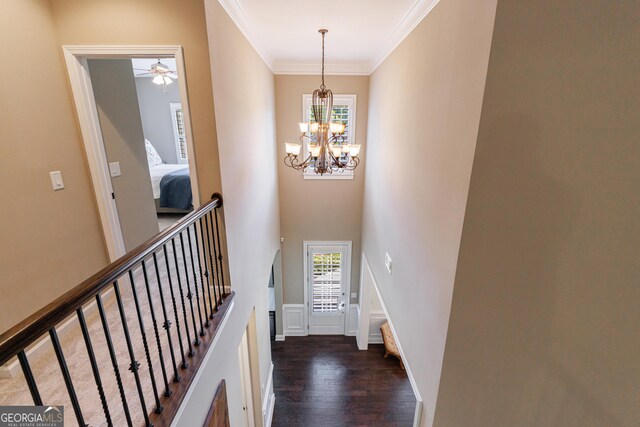 621 Oakbourne Way, Woodstock, GA 30188 - entrance foyer with dark wood-type flooring, a chandelier, stairs, ornamental molding, and ceiling fan