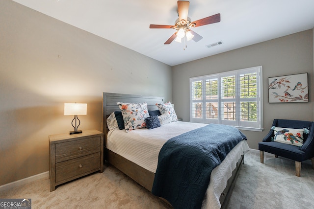 621 Oakbourne Way, Woodstock, GA 30188 - bedroom featuring light colored carpet, baseboards, and a ceiling fan