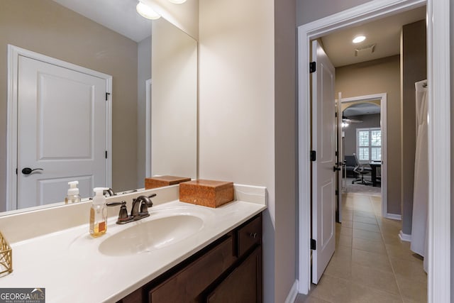 621 Oakbourne Way, Woodstock, GA 30188 - bathroom with tile patterned flooring, vanity, baseboards, and a ceiling fan