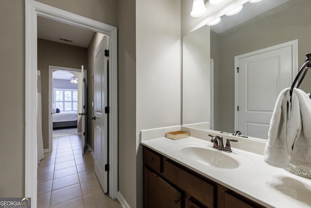 621 Oakbourne Way, Woodstock, GA 30188 - bathroom with tile patterned floors, vanity, baseboards, and ensuite bathroom