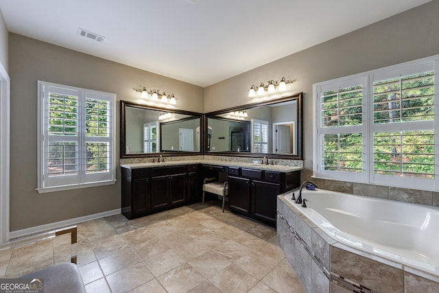 621 Oakbourne Way, Woodstock, GA 30188 - bathroom with plenty of natural light, a bath, and double vanity