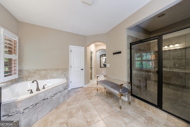 621 Oakbourne Way, Woodstock, GA 30188 - bathroom featuring a stall shower and a bath