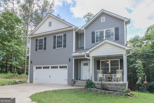 1609 Dillard Bray Rd, Royston, GA 30662 - traditional-style home featuring concrete driveway, a front yard, covered porch, and a garage