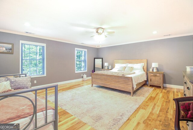 1609 Dillard Bray Rd, Royston, GA 30662 - bedroom with a ceiling fan, crown molding, visible vents, baseboards, and light wood-style floors