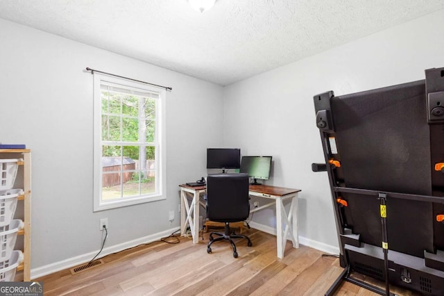 37 Winesap Ct, Temple, GA 30179 - home office with wood finished floors and a textured ceiling