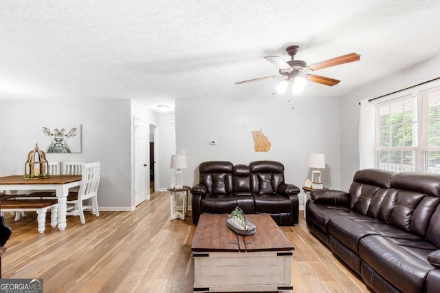 37 Winesap Ct, Temple, GA 30179 - living area featuring a ceiling fan, light wood-type flooring, and a textured ceiling