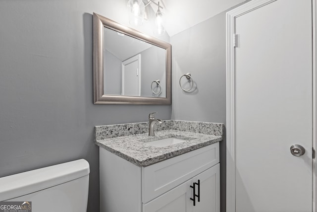bathroom with vanity and toilet