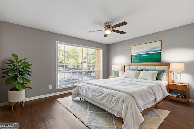 bedroom with baseboards, a ceiling fan, and wood finished floors