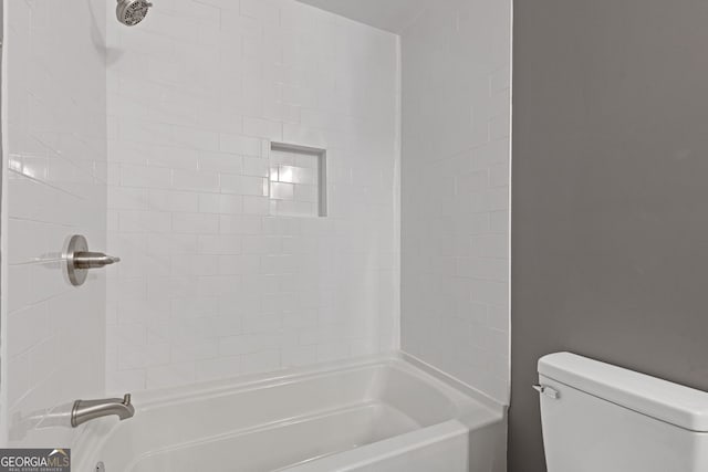 bathroom with toilet and  shower combination
