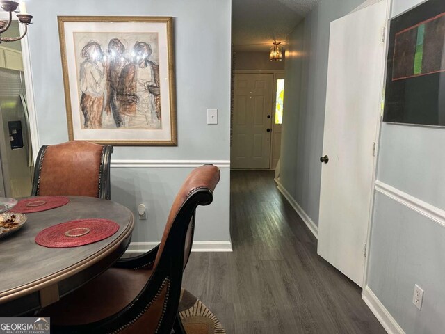 6119 Woodmont Blvd, Peachtree Corners, GA 30092 - dining area featuring a textured ceiling and wood finished floors