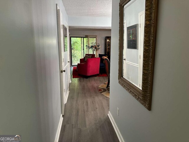 6119 Woodmont Blvd, Peachtree Corners, GA 30092 - carpeted living area with a textured ceiling, a chandelier, and a fireplace