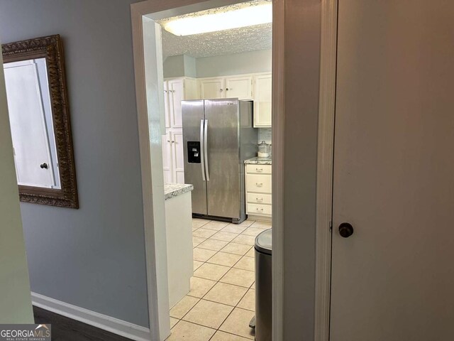 6119 Woodmont Blvd, Peachtree Corners, GA 30092 - dining room featuring a textured ceiling and wood finished floors