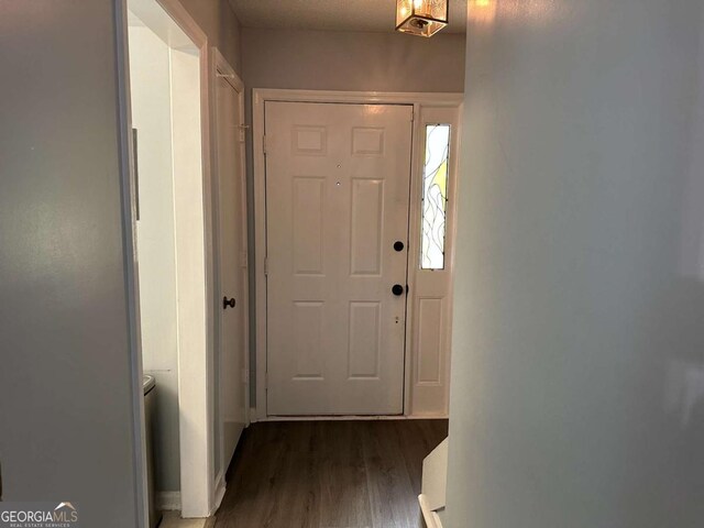 6119 Woodmont Blvd, Peachtree Corners, GA 30092 - hall featuring a textured ceiling, baseboards, and wood finished floors