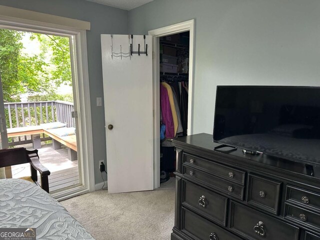 6119 Woodmont Blvd, Peachtree Corners, GA 30092 - carpeted bedroom with a textured ceiling and ceiling fan