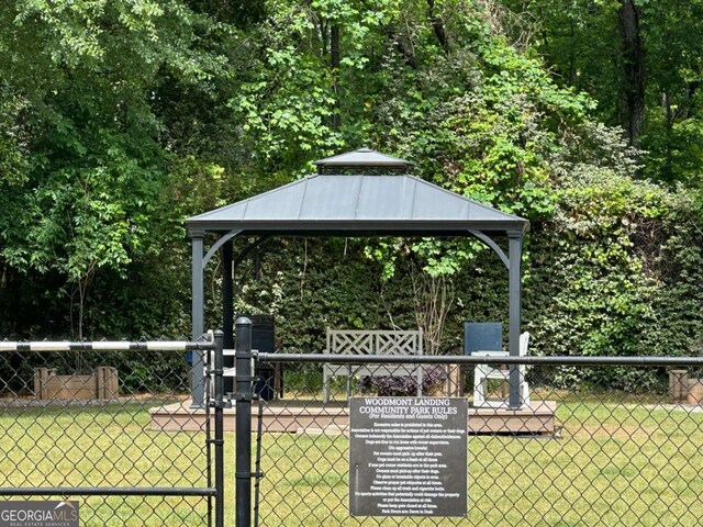 6119 Woodmont Blvd, Peachtree Corners, GA 30092 - view of front of house with a chimney and a balcony