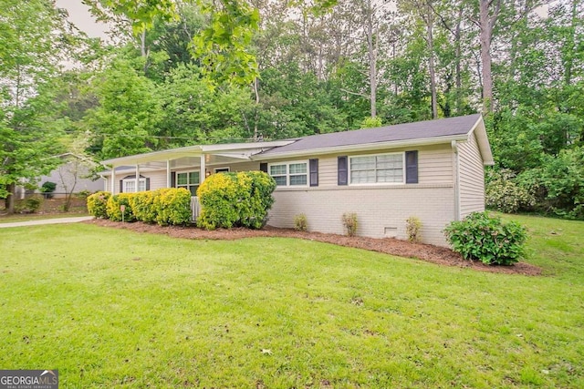 single story home featuring brick siding and a front lawn