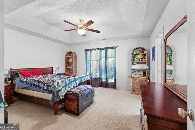 425 W Ridgeway Rd, Maysville, GA 30558 - bedroom featuring a raised ceiling, carpet floors, ceiling fan, and a textured ceiling
