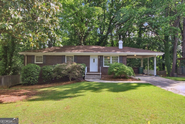 single story home featuring a chimney, fence, concrete driveway, a front lawn, and brick siding