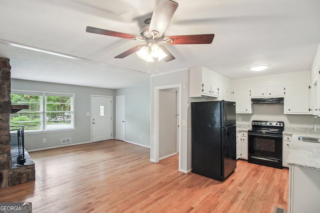 kitchen with under cabinet range hood, ceiling fan, a sink, visible vents, and black appliances
