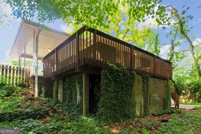 rear view of property with a wooden deck